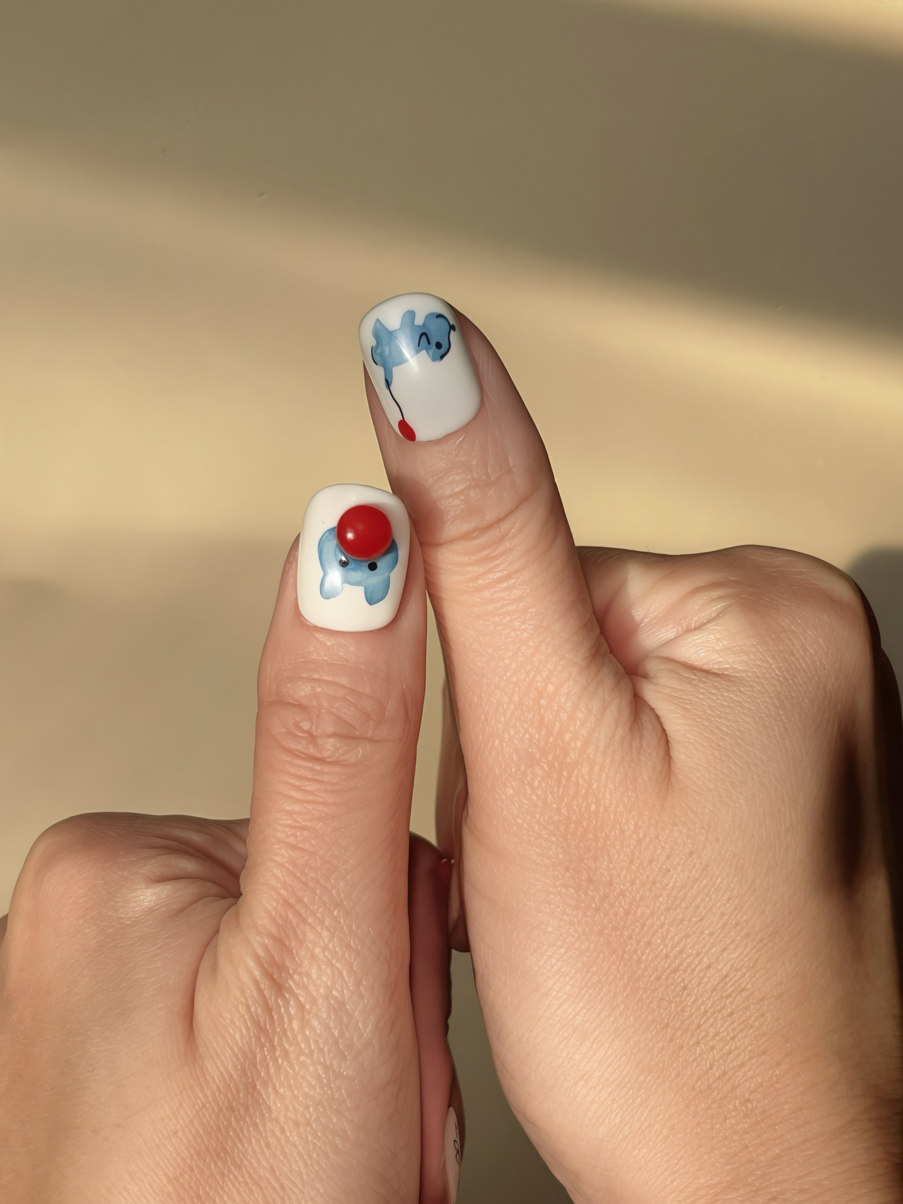Blue puppy nail art with red balloon on thumb in Balloon Buddy press-on set