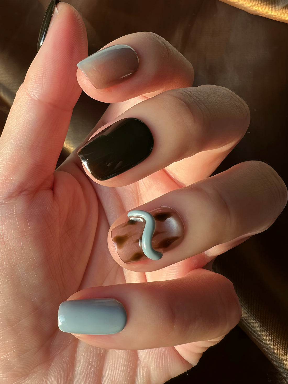 Black and taupe press on nails with metallic 3D twist detail — minimalist neutral nail stick ons, modern square stick on nails UK