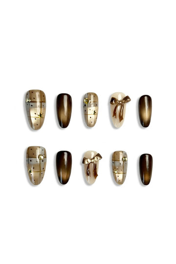 Cocoa Giftbox brown Christmas press-on nails with cat-eye gradient, 3D bow design, and festive giftbox pattern — elegant winter manicure UK