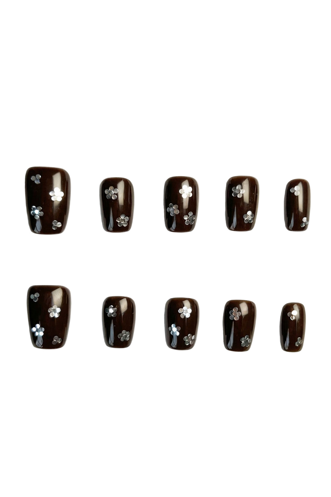 Cocoa Petals brown press-on nails with tiny silver floral shimmer flatlay