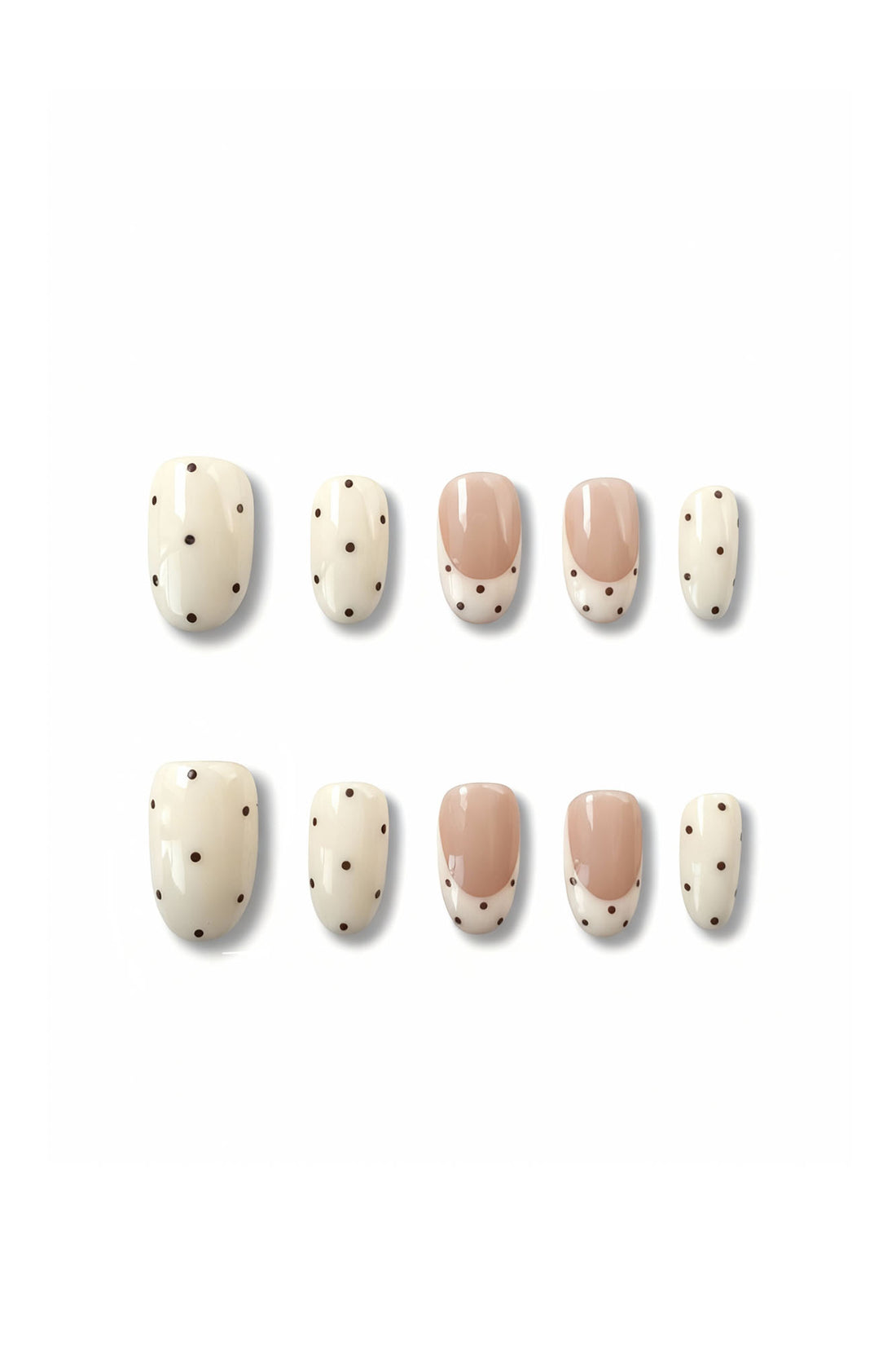 Dotting Audrey press-on nails flatlay showing nude and white polka dot oval nail set