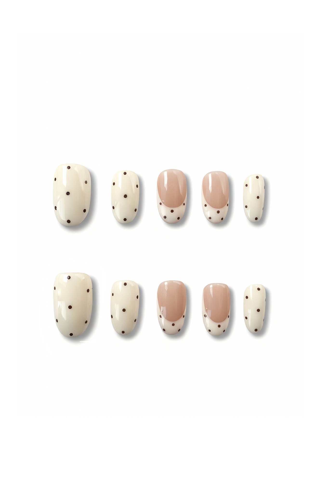 Dotting Audrey press-on nails flatlay showing nude and white polka dot oval nail set