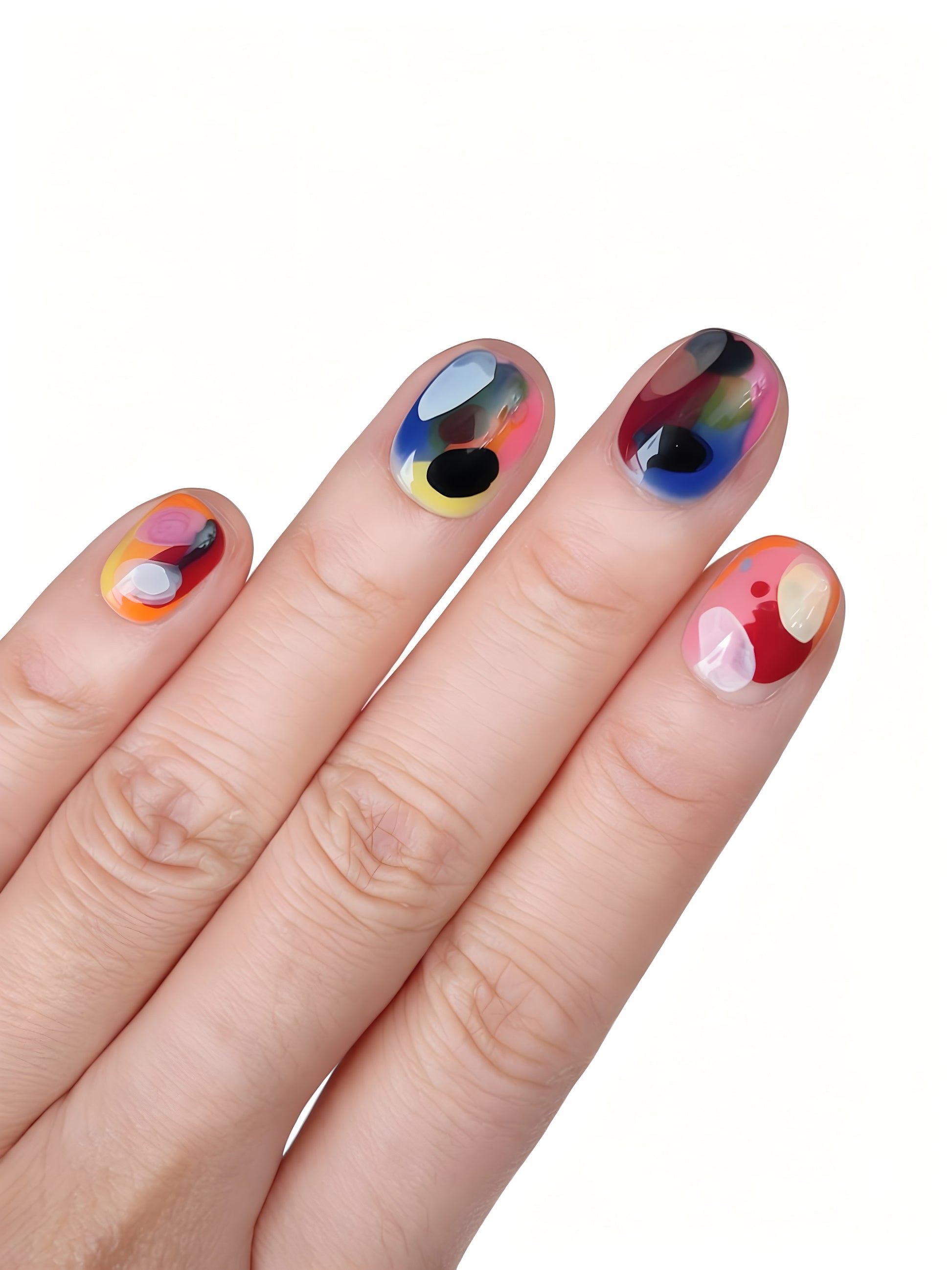Close-up of Dopamine Crush press-on nails with bold abstract brushstroke designs in orange, pink, blue, lilac, and yellow.
