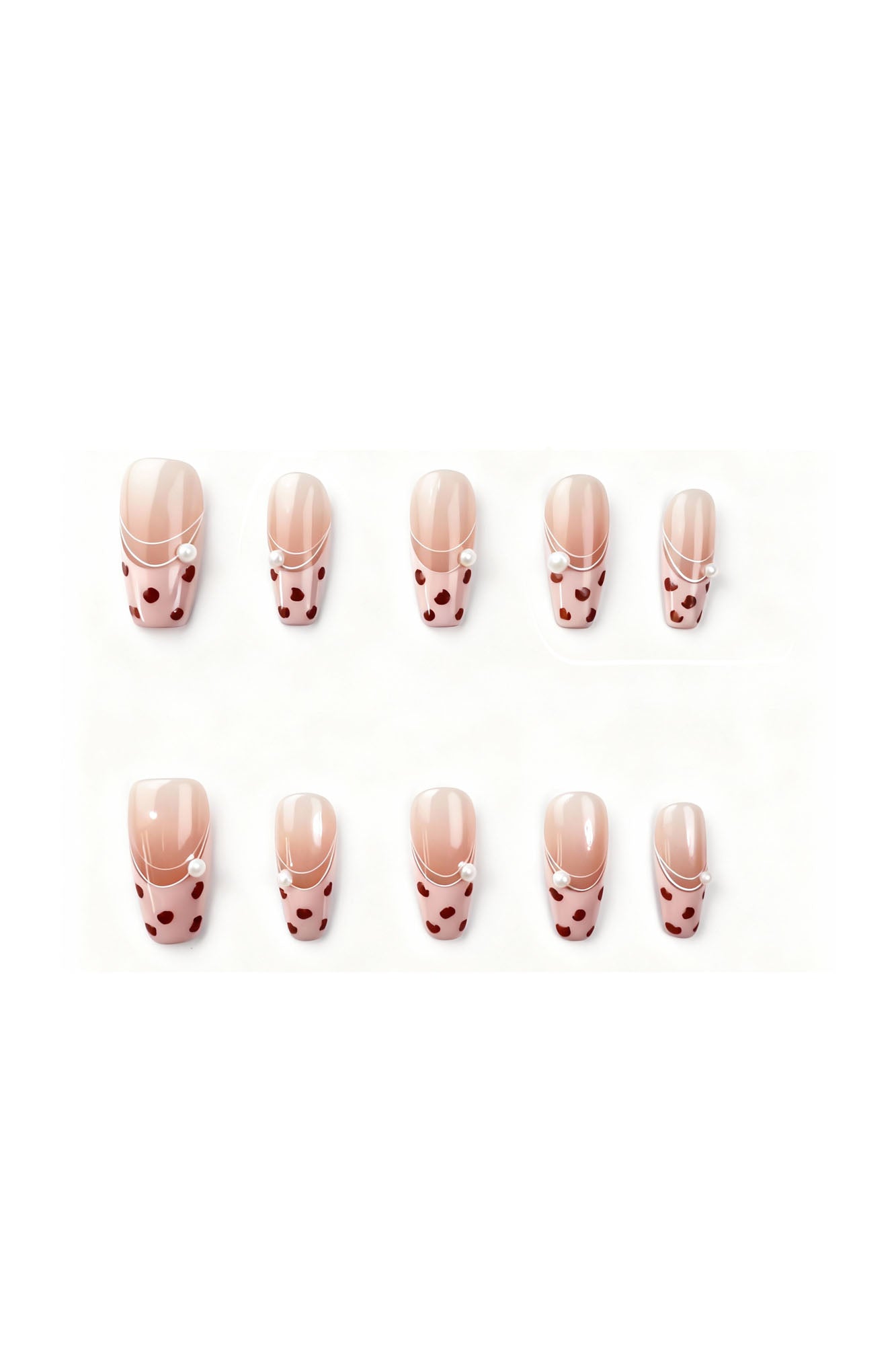 Gentle Wild press-on nails flatlay featuring blush-pink French tips with deep red leopard spots and tiny pearl details.