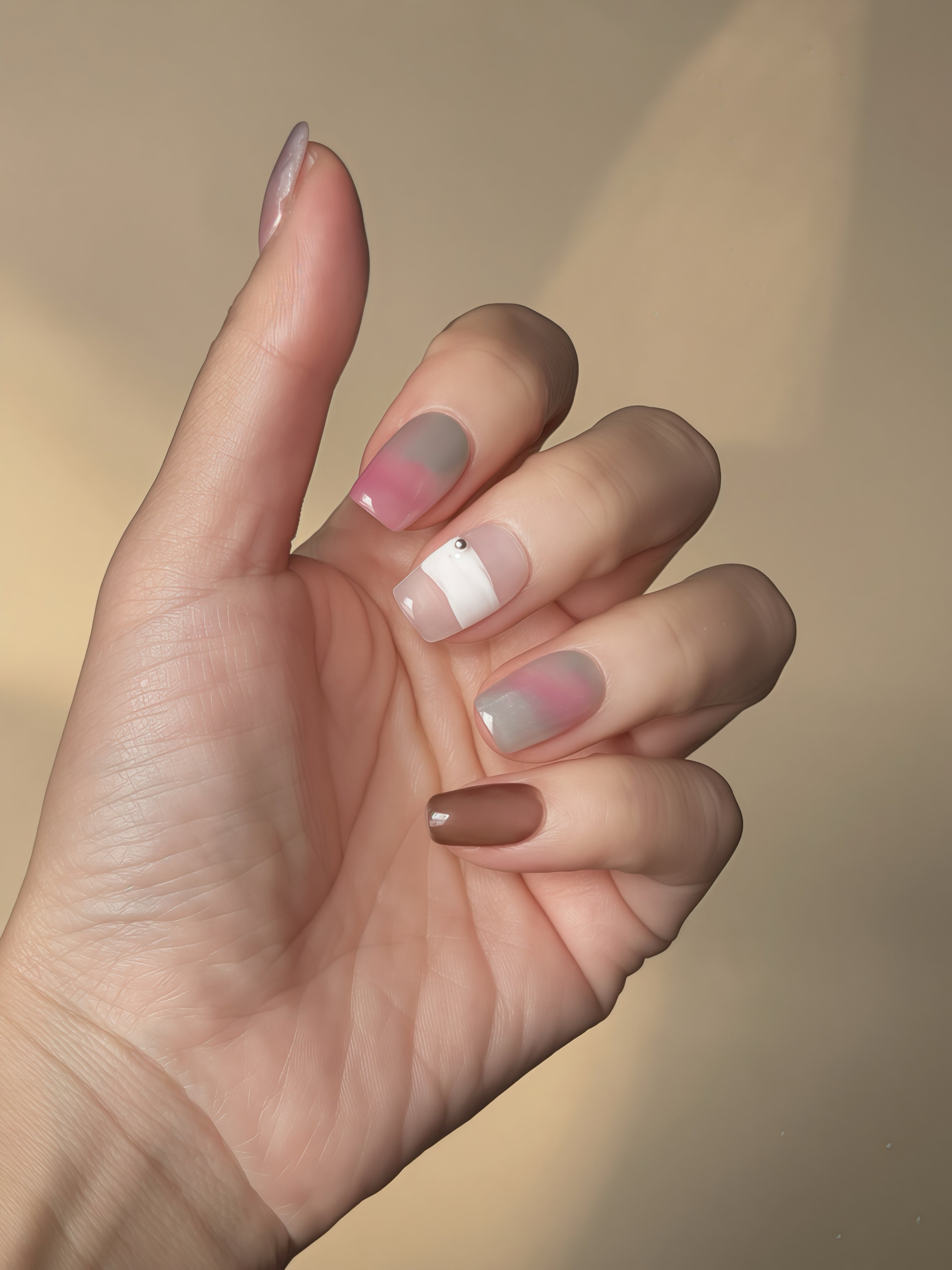 Peony Mist press-on nails shown in natural lighting with soft gradients and watercolor floral tones.