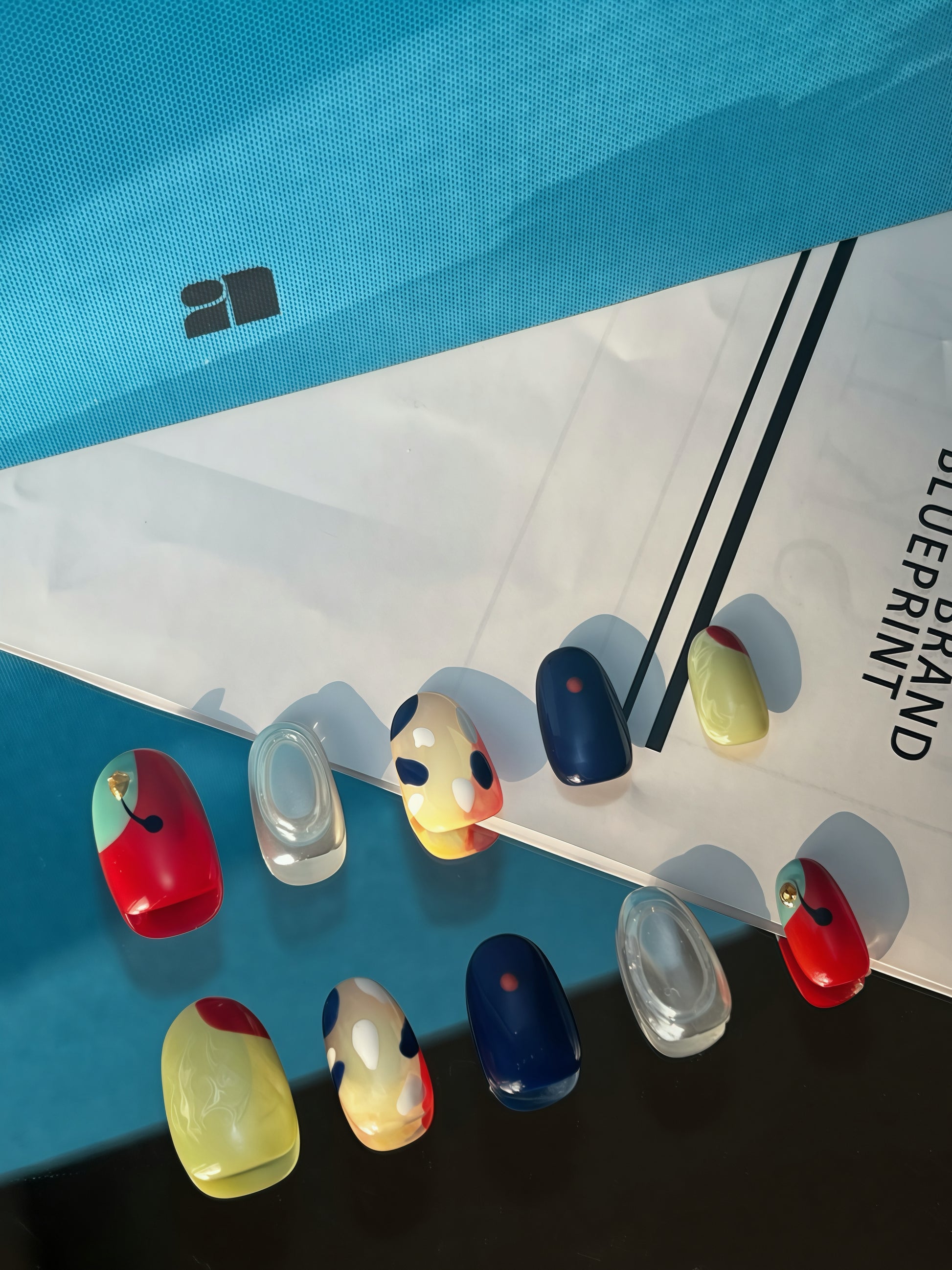 Reusable colour-block press-on nails inspired by modern art — a high-end gel manicure alternative for busy professionals.