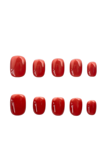 Classic glossy red press-on nails in a short square shape