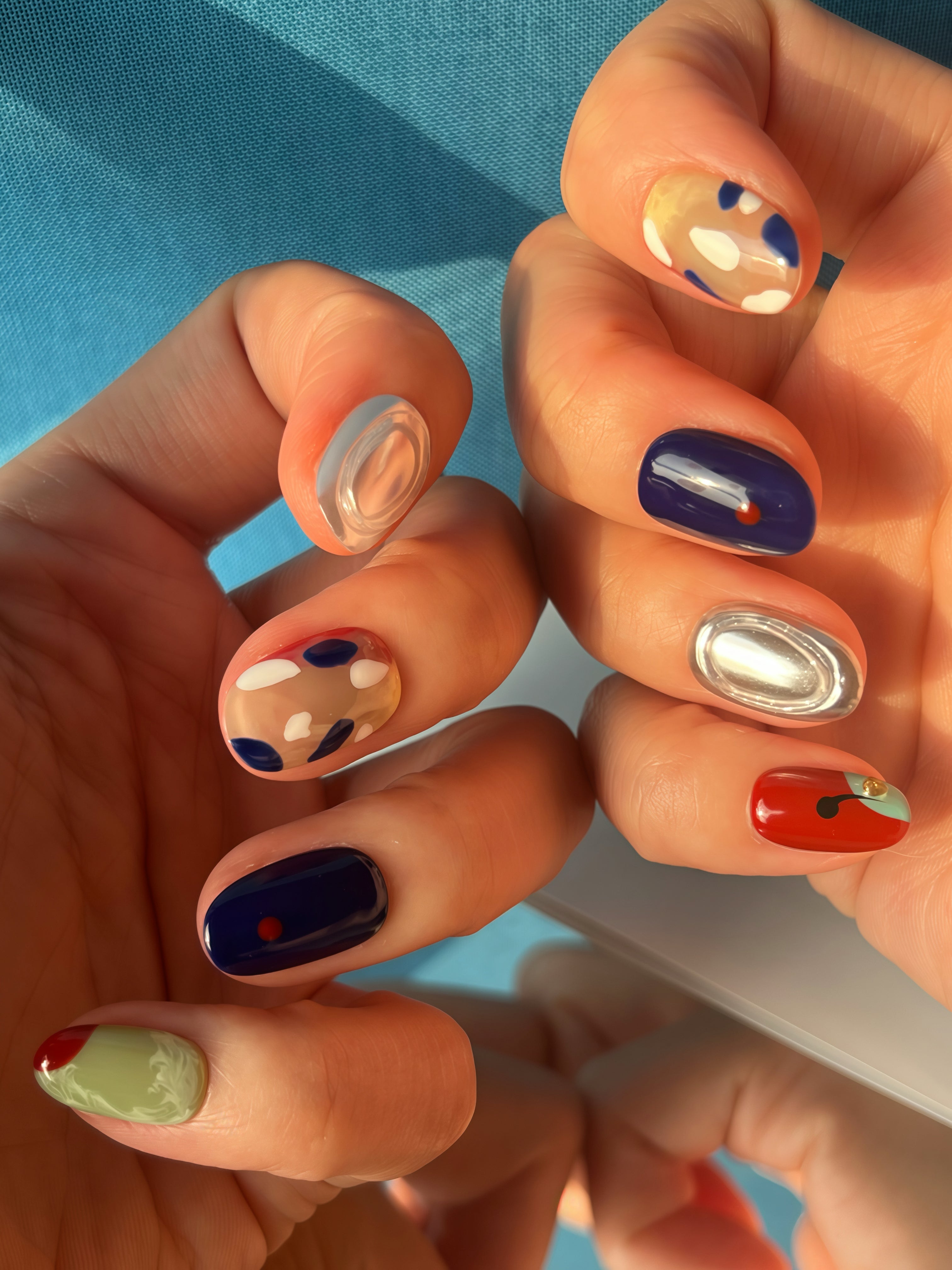 Hand wearing Urban Canvas abstract art press-on nails — luxury reusable nail set by Momento.