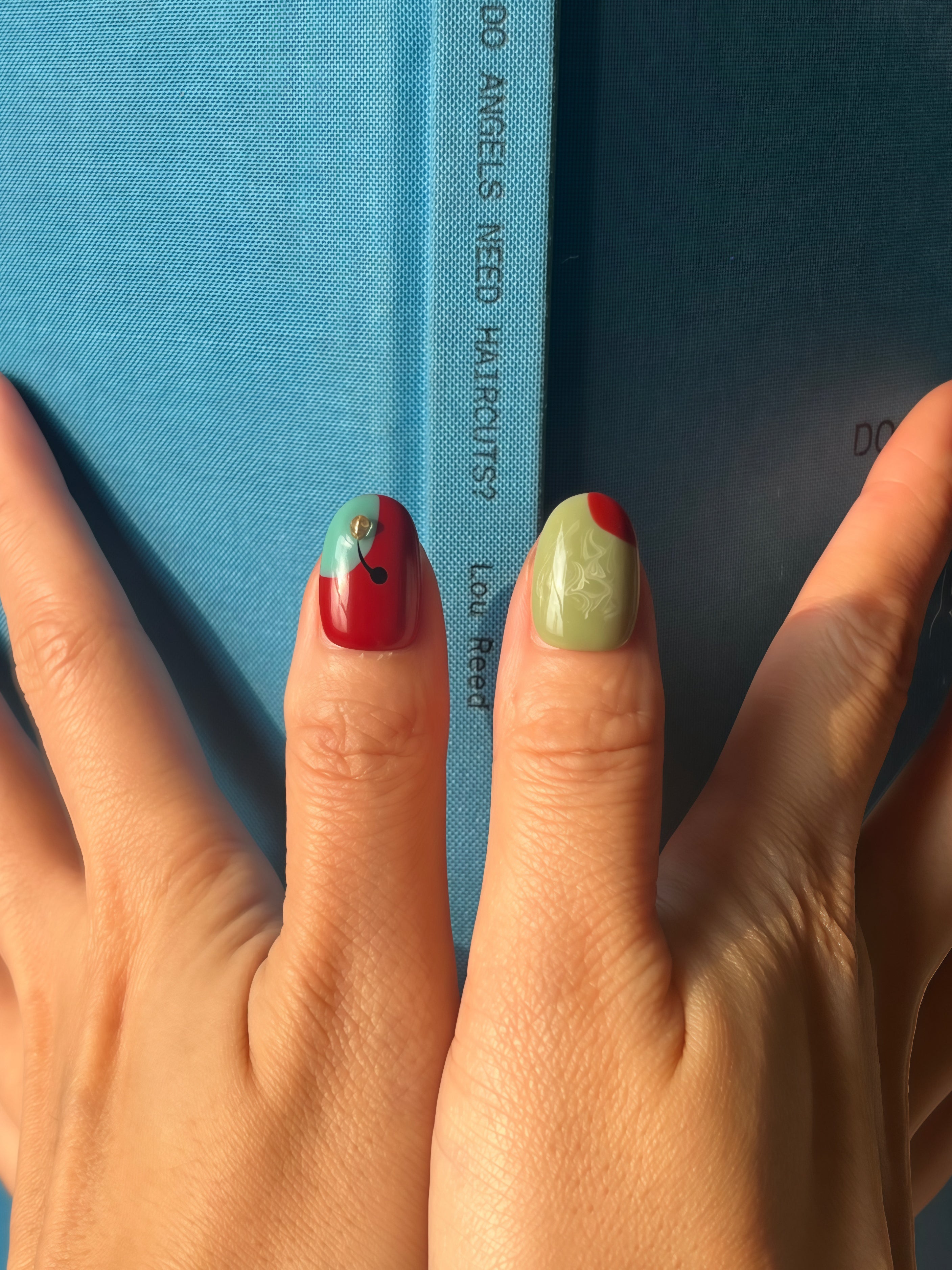 Hand wearing Urban Canvas abstract art press-on nails — luxury press on nail set by Momento.